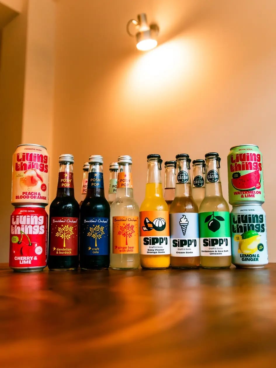 A line-up of craft sodas — Living Things, Posh Pop, Breckland Orchard and Sipp'd